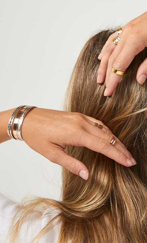 Assortment of sound wave jewelry on female