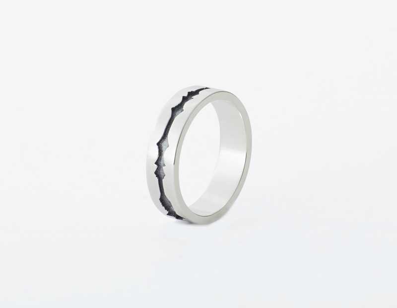 The Outer Wave Ring placed vertical in Antiqued Sterling Silver