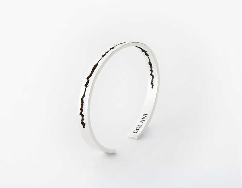 The Cut Wave Bracelet placed vertical in Antiqued Sterling Silver
