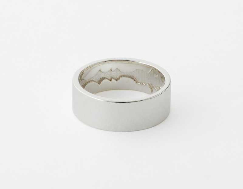 The Inner Wave Ring placed horizontal in Sterling Silver